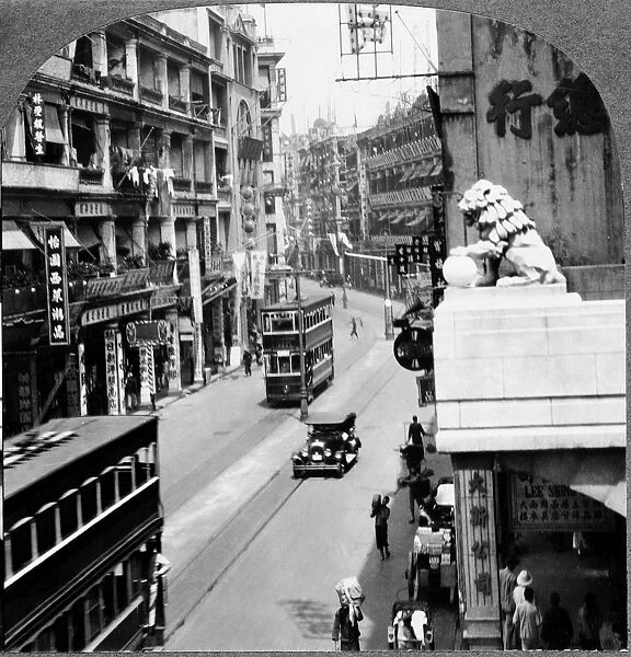 CHINA: HONG KONG, c1935. A busy street in the shopping district of Victoria, Hong Kong, China