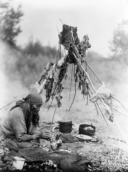 CURTIS: SARSI COOK, c1927. A Sarsi Native American in Alberta, Canada, preparing food