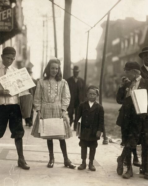 DELAWARE: NEWSBOYS, 1910. Girls and boys selling papers at Wilmington, Delaware