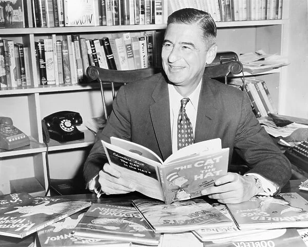 DR. SEUSS (1904-1991). American writer and cartoonist. In his office with several of his books