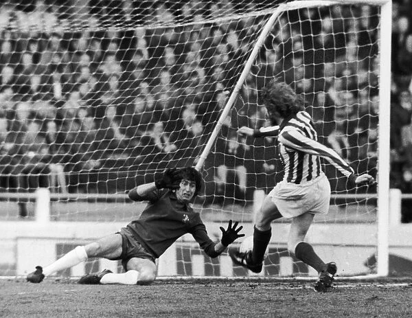 ENGLAND: SOCCER MATCH, 1973. Soccer match between Chelsea FC and Stoke City FC. Peter Bonetti of Chelsea blocks a goal shot by Terry Conroy, 7 April 1973