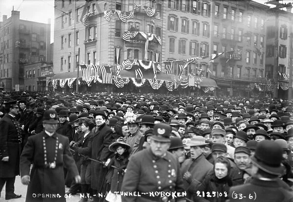 HUDSON RIVER TUNNEL, 1908. Crowds gathered in Hoboken, New Jersey, to watch the