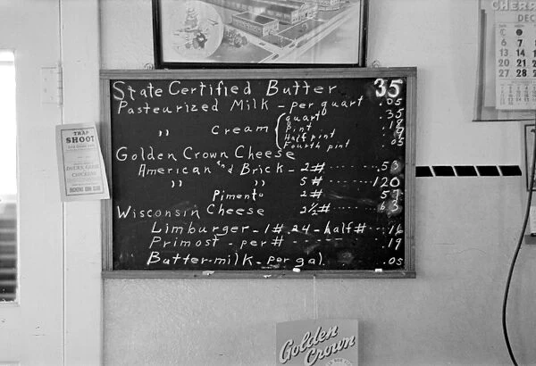IOWA: CREAMERY, 1936. A sign showing the retail prices of dairy products at a farmer