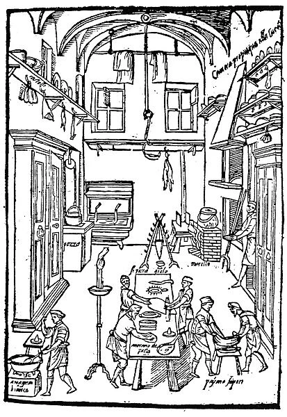 KITCHEN SCENE, 1605. Cooks at work in the kitchen of a noble home. Woodcut from Opera di M