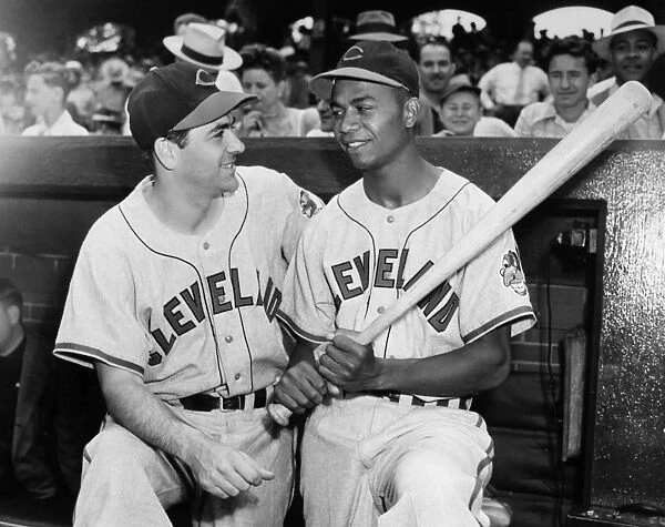 LARRY DOBY (1923-2003). American baseball player, and first black player in the American League. Doby (right) photographed with Lou Boudreau, manager of the Cleveland Indians, on his first day with the team, 5 July 1947