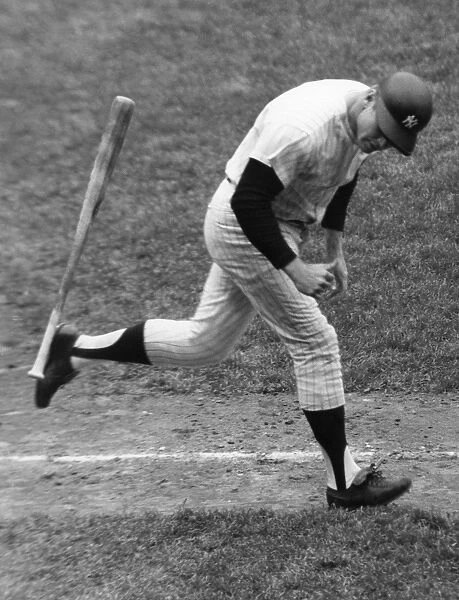 MICKEY MANTLE (1931-1995). American baseball player. As a member of the New York Yankees, tossing his bat aside and beginning his trot around the bases after hitting his 500th career home run off of pitcher Stu Miller of the Baltimore Orioles, at Yankee Stadium in the Bronx, New York City, 14 May 1967