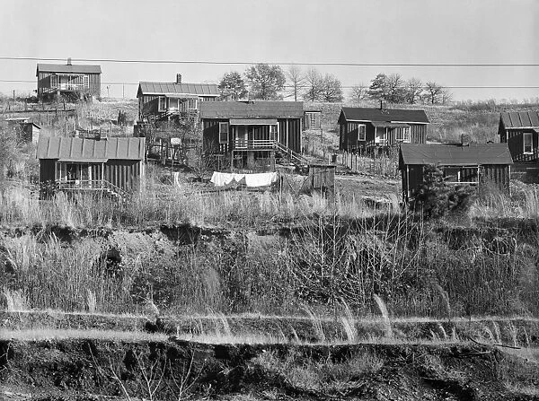 MINERS HOMES, 1935. A group of miners houses near Birmingham, Alabama