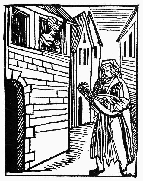 MINSTREL, 16th CENTURY. A minstrel performing a song on the lute. Woodcut, German