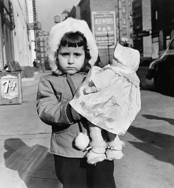 NEW YORK: MOTT STREET. Child with a doll on Mott Street, New York City