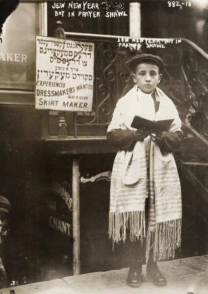 NEW YORK: ROSH HASHANAH. A young Jewish boy wearing a prayer shawl on Rosh Hashanah