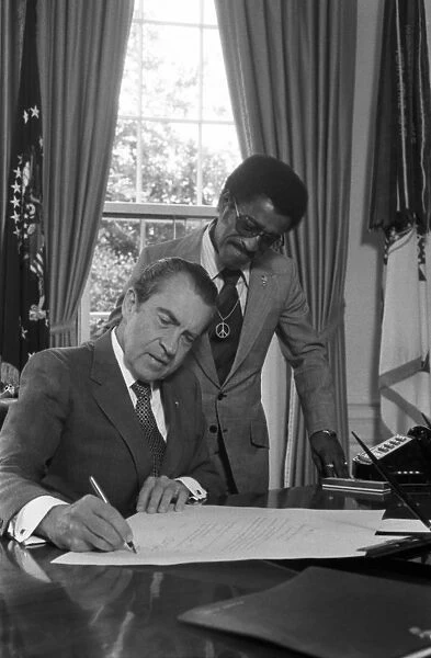 NIXON AND DAVIS JR. 1971. President Richard Nixon appointing Sammy Davis Jr