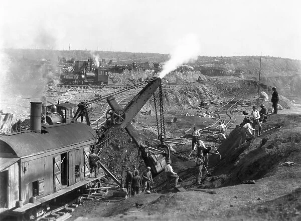 OPEN PIT MINING, 1903. Steam shovels mining iron ore at Mesabi Range, Minnesota