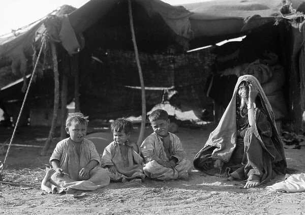 PALESTINE: BEDOUIN FAMILY. A Bedouin mother and three boys outside their tent at Beersheba