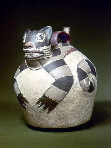 PERU: NAZCA WHISTLING JAR. Ceramic whistling water jar with a sculpted cat on the top, made by the Nazca civilization of ancient Peru, 1st to 8th century A. D