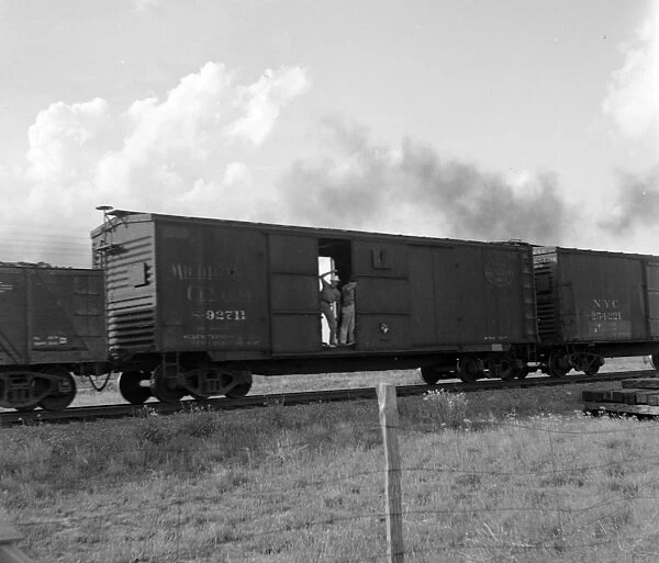 RAILROAD, 1937. Men riding on a freight train in West Texas. Photograph by Dorothea Lange