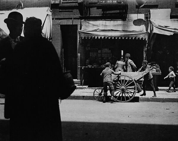 RIIS: PUSHCART, C1910. A vendors pushcart on a street in New York City. Photograph