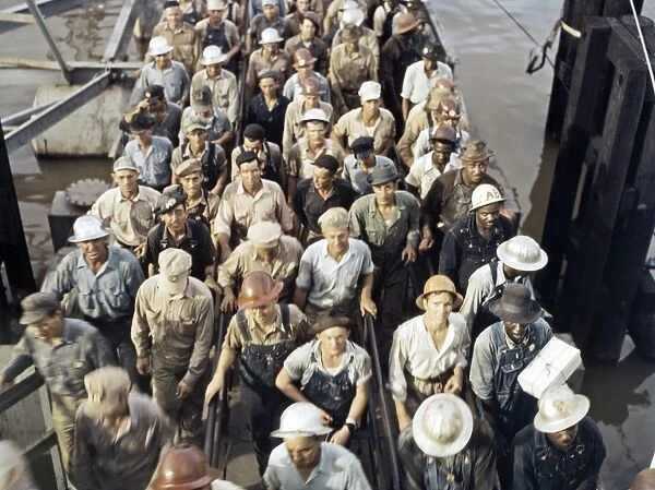 SHIPBUILDING, 1943. Workers leaving the Pennsylvania Shipyards in Beaumont, Texas