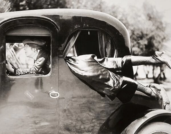 SILENT FILM: AUTOMOBILES. Dale Fuller demonstrates the proper way for a Keystone lady to enter her car