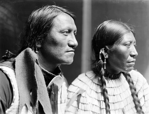 SIOUX COUPLE, c1900. Charging Thunder, a Sioux Native American, and his wife