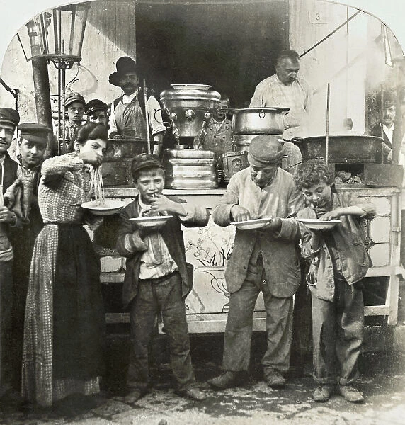 SPAGHETTI VENDOR, c1908. Spaghetti vendor serving food in Naples, Italy. Photograph