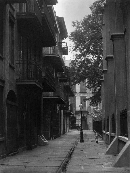 ULMANN: ALLEYWAY, c1930. An alleyway in a city somewhere in the American South
