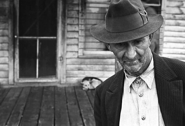 UNEMPLOYED MINER, 1935. An unemployed miner in the deserted mining town of Zinc, Arkansas