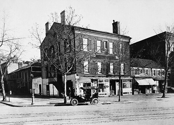 WASHINGTON D. C. 1912. Paint store and Chinese laundry on the corner of 19th