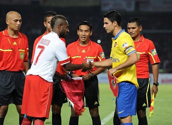Mikel Arteta and Boaz Solossa Clash in Arsenal's Encounter with Indonesia All-Stars (2013)