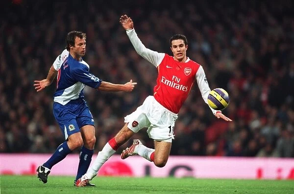 Robin van Persie (Arsenal) is fouled by Lucas Neill (Blackburn) for the penalty