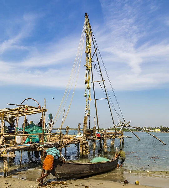 A fishing boat and the Chinese fishing nets at Fort Kochi