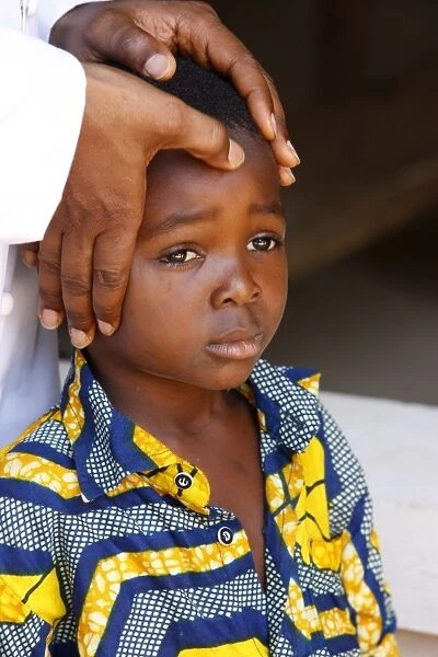 African child blessed by a priest