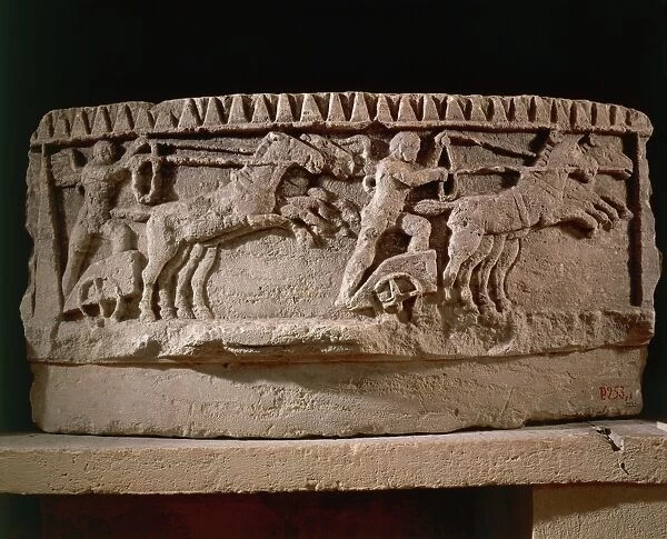 Architectural fragment depicting winged genius driving chariot on circus track