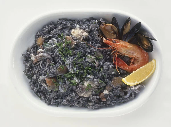 Arros negre, a paella-style, black rice and seafood dish from Catalonia, Spain, view from above