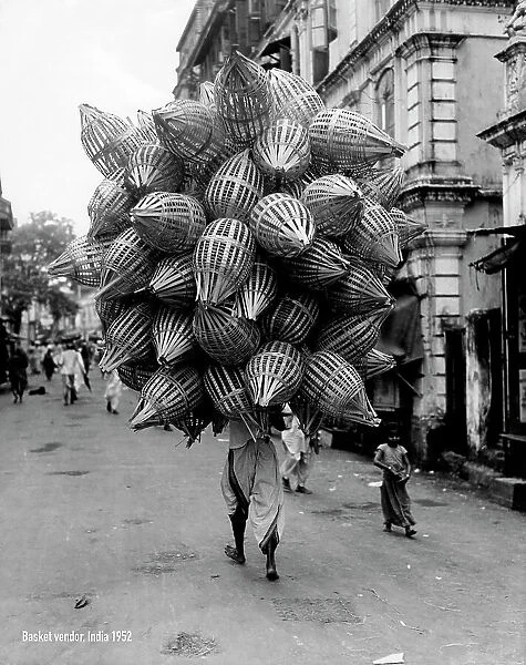 Asia, india, bombay, vendor of baskets, 1952