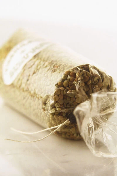 Bag of green lentils tied with a string, close up