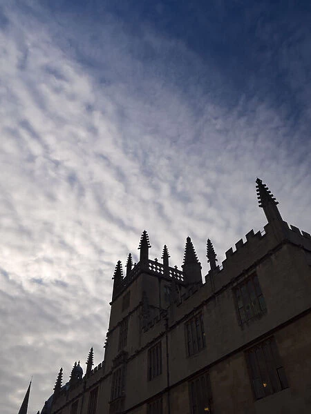 The Bodleian Library, Oxford, silhouetted against a dramatic cloudy sky