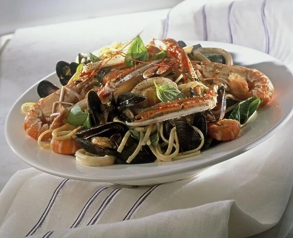 Bowl of spaghetti with mixed shellfish including prawns and mussels