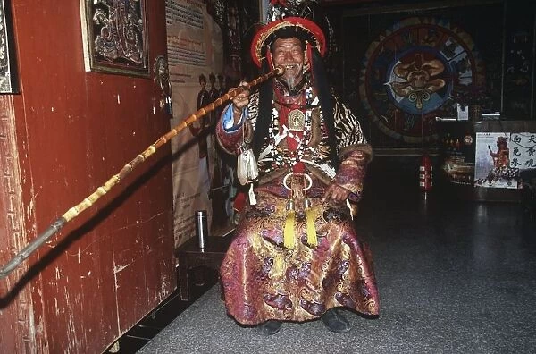 China, Yunnan, Lijiang, man in traditional Naxi costume