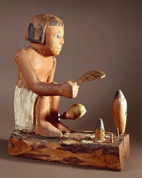 Egypt, Asyut, Statuette representing a cook trying to roast a duck, coloured plastered wood