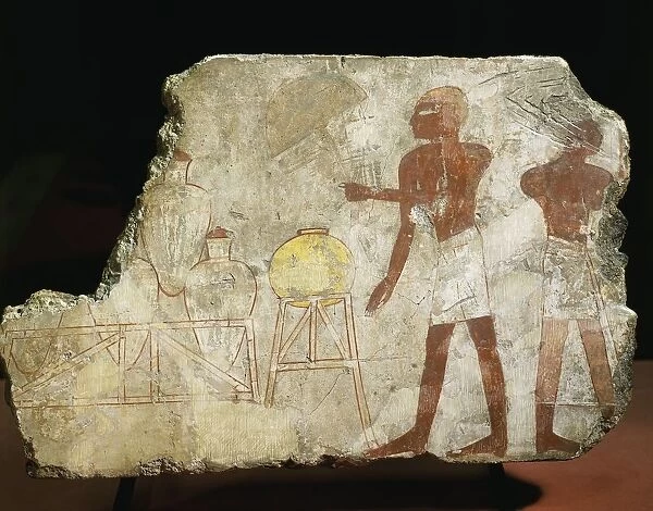 Fragment of painting on lemon wood depicting servants and amphora on their stands, from Thebes