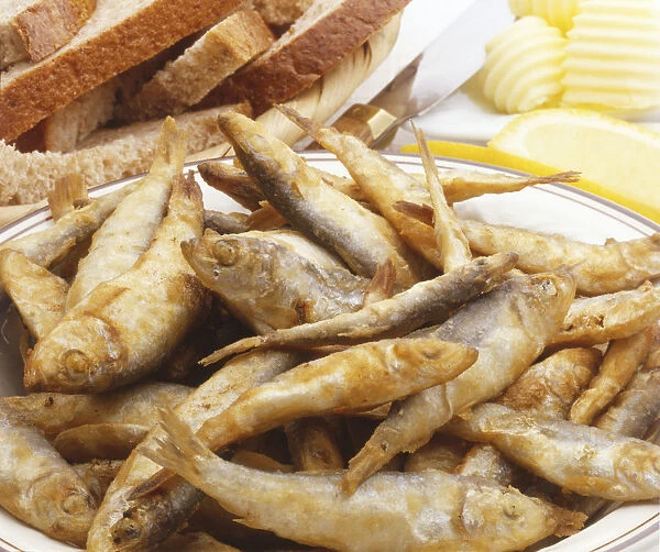 Fried whitebait, served with sliced bread and butter