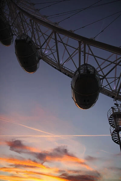 Gondolas of the Millennium Wheel silhouetted at sunset