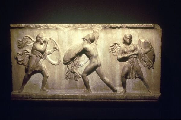 Greek warrior fighting Amazons, the female warriors. 8th-5th century BC. Limestone