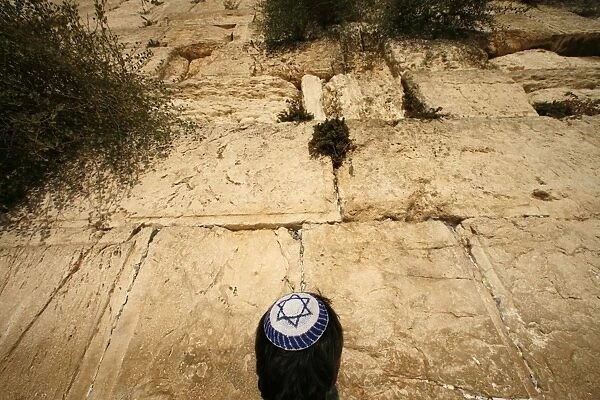 An Israeli Jew prays at the Western Wall
