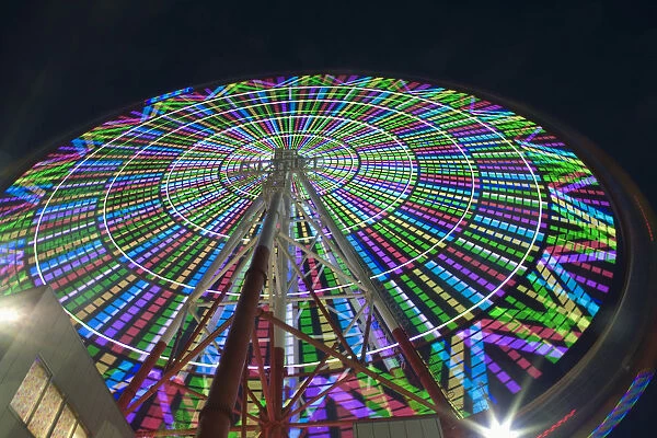 Japan, Tokyo Prefecture, Odaiba, low angle view of the Daikanransha ferris wheel at Palette Town amusement park, night