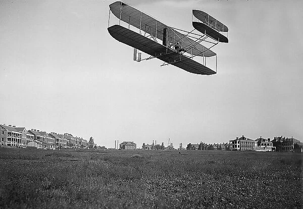 Orville Wright piloting an early aeroplane