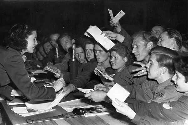 Parliament of free german youth in leipzig, may 29, 1952, raymonde dien, valiant french fighter for peace, giving her autograph to participants of the congress