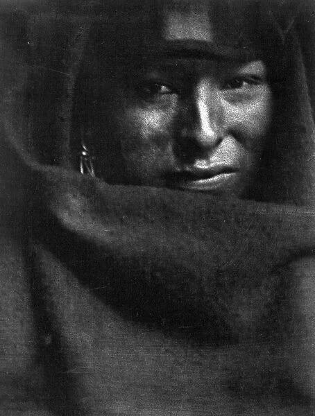 Photograph showing head-and-shoulders portrait of Native American man, 1902. Photographer