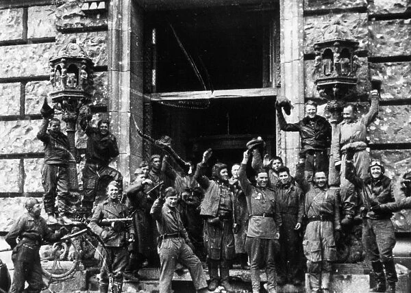 Soviet red army soldiers celebrating outside the reichstag (chancery) building, fall of berlin, may 1945, world war 2