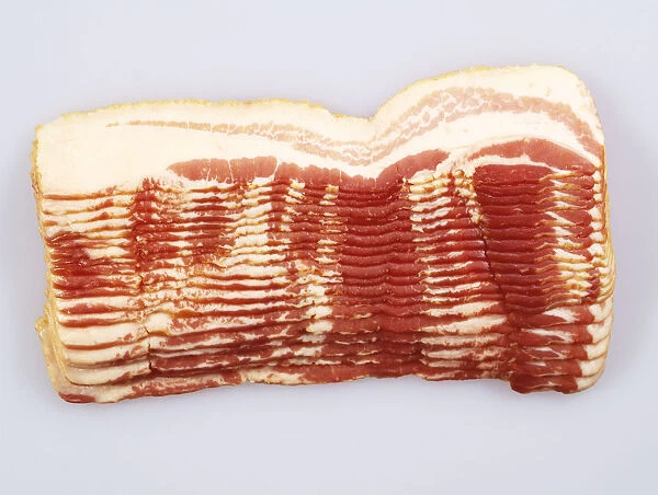 Stacked slices of uncooked bacon